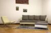 Salón con sillón barcelona y sofá moderno