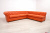 Sofá Chesterfield de piel naranja hecho a medida con península