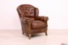 Sillón clásico de cuero marrón y madera